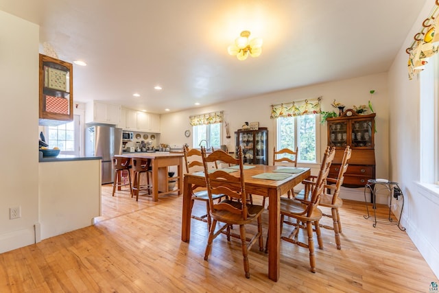 1 W Railroad St, Ely, MN 55731 - dining room featuring light wood-style floors, recessed lighting, a chandelier, and baseboards