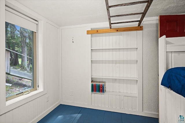 115 Copperhead Rd, Knife River, MN 55616 - spare room featuring a textured ceiling, a textured wall, and baseboards