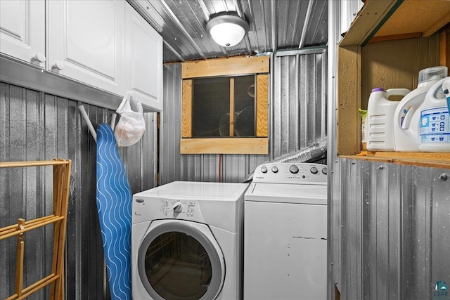 115 Copperhead Rd, Knife River, MN 55616 - washroom featuring washing machine and clothes dryer and cabinet space