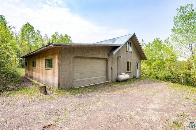 115 Copperhead Rd, Knife River, MN 55616 - view of side of property featuring a detached garage and metal roof