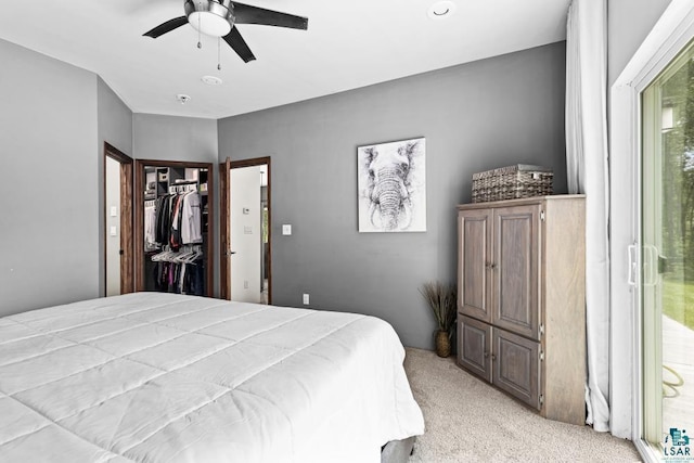 5386 Martin Rd, Duluth, MN 55811 - bedroom featuring light carpet, a ceiling fan, and a spacious closet
