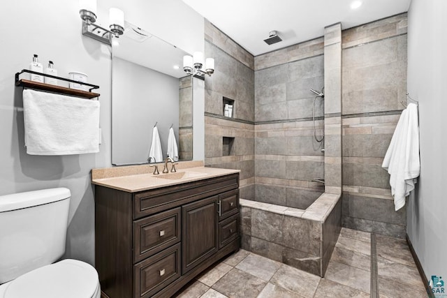 5386 Martin Rd, Duluth, MN 55811 - bathroom featuring vanity, toilet, tiled shower, and recessed lighting