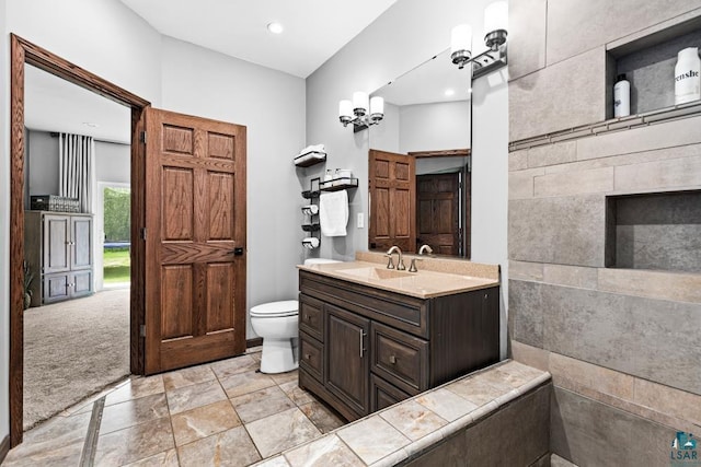 5386 Martin Rd, Duluth, MN 55811 - bathroom featuring vanity, toilet, and recessed lighting