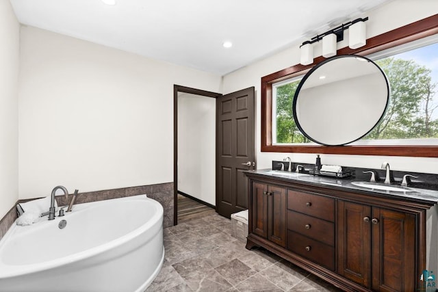 5386 Martin Rd, Duluth, MN 55811 - full bathroom featuring double vanity, a tub to relax in, and recessed lighting