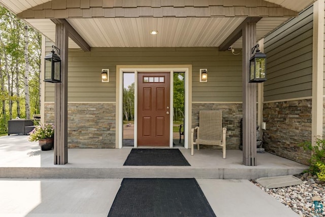 5386 Martin Rd, Duluth, MN 55811 - doorway to property featuring stone siding and a porch