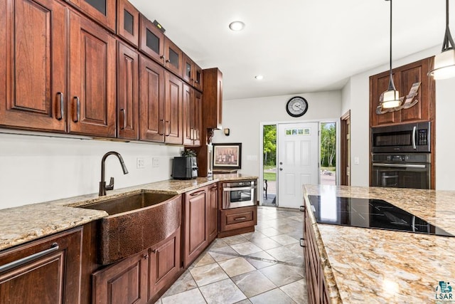 5386 Martin Rd, Duluth, MN 55811 - kitchen with black appliances, a sink, light tile patterned floors, light stone countertops, and recessed lighting