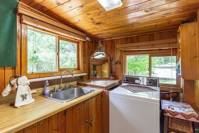 3666 Mackie Rd, Ely, MN 55731 - washroom featuring wood ceiling, wooden walls, and washing machine and clothes dryer