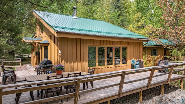 3666 Mackie Rd, Ely, MN 55731 - back of house with outdoor dining area, a wooden deck, and metal roof