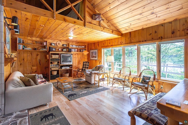 3666 Mackie Rd, Ely, MN 55731 - living room featuring wooden walls, wooden ceiling, wood finished floors, and vaulted ceiling