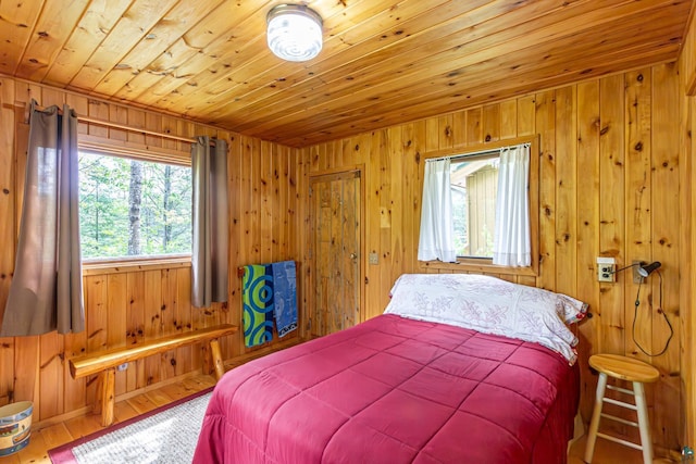 3666 Mackie Rd, Ely, MN 55731 - bedroom featuring wooden ceiling, wooden walls, and wood finished floors