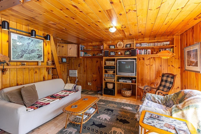 3666 Mackie Rd, Ely, MN 55731 - living room featuring wood walls, wood finished floors, and wooden ceiling