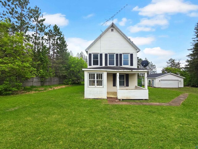 3756 Main St, Barnum, MN 55707 - rear view of property featuring a detached garage and a porch