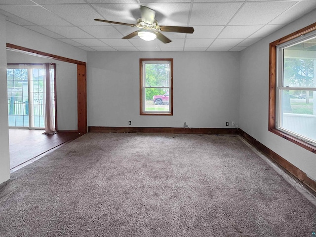 3756 Main St, Barnum, MN 55707 - spare room featuring a paneled ceiling, ceiling fan, carpet, and baseboards