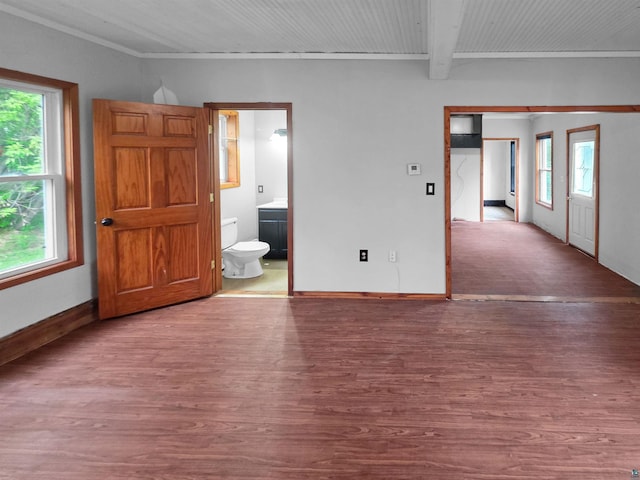 3756 Main St, Barnum, MN 55707 - unfurnished bedroom with wood finished floors, baseboards, beamed ceiling, crown molding, and connected bathroom