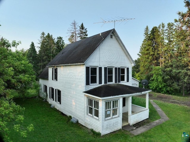 3756 Main St, Barnum, MN 55707 - rear view of house featuring a lawn and roof with shingles