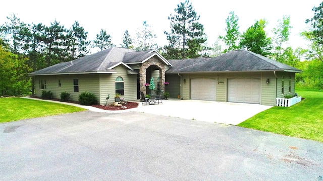 58950 State Highway 23, Sandstone, MN 55072 - ranch-style home featuring an attached garage, a front yard, driveway, and a shingled roof