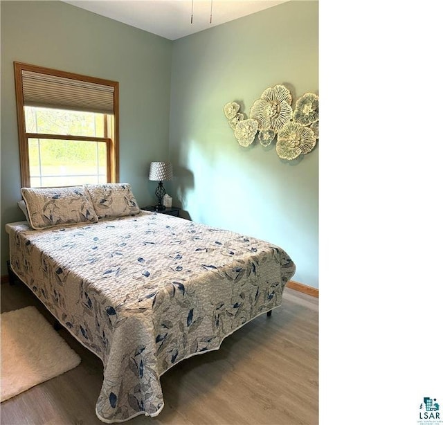 58950 State Highway 23, Sandstone, MN 55072 - bedroom with wood finished floors and baseboards