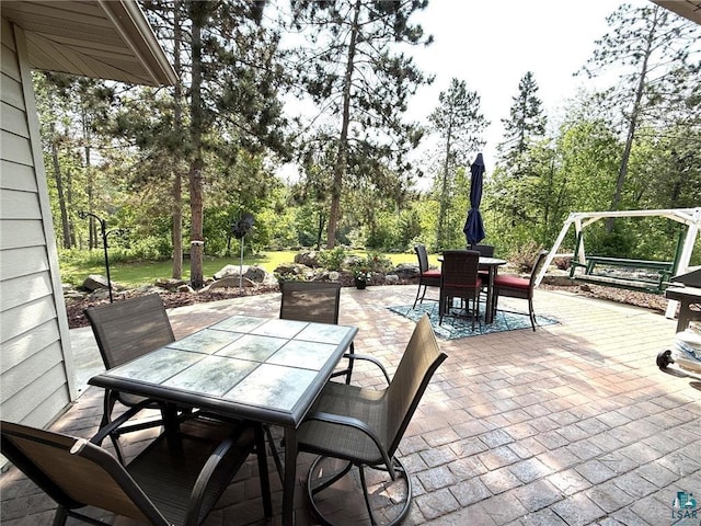 58950 State Highway 23, Sandstone, MN 55072 - view of patio / terrace featuring outdoor dining space and view of scattered trees