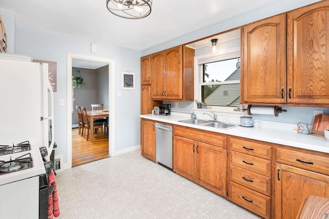 2006 Gearhart St, Duluth, MN 55811 - kitchen with dishwasher, a sink, range with gas stovetop, and brown cabinets