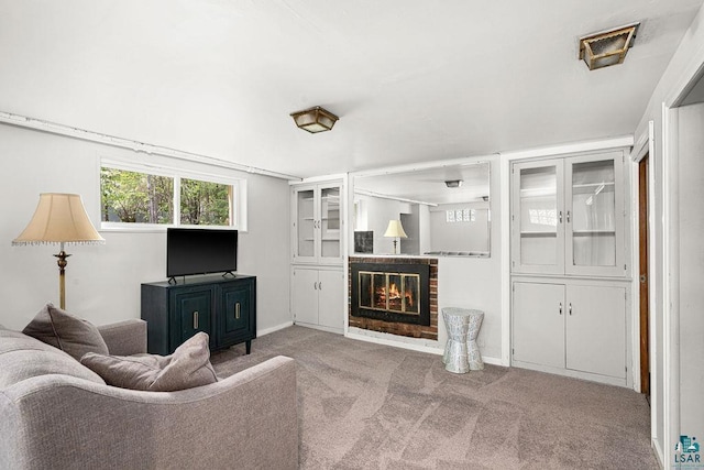 3319 E Superior St, Duluth, MN 55804 - carpeted living area featuring a brick fireplace and baseboards