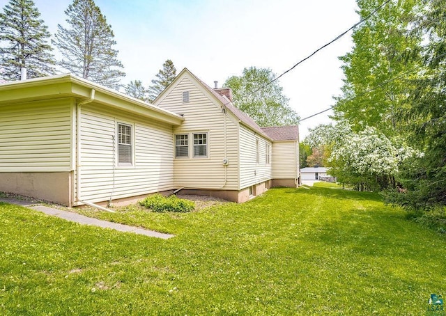 3319 E Superior St, Duluth, MN 55804 - view of home's exterior featuring a yard and a chimney