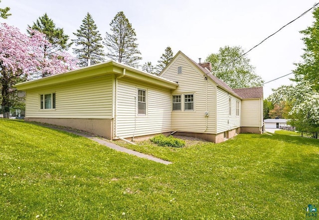 3319 E Superior St, Duluth, MN 55804 - view of home's exterior with a yard and a chimney