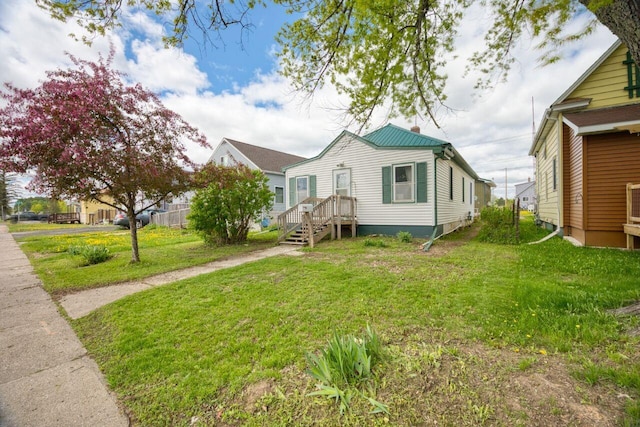 316 W 3rd Ave N, Aurora, MN 55705 - view of home's exterior featuring a yard