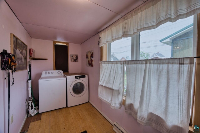 316 W 3rd Ave N, Aurora, MN 55705 - washroom featuring washer and clothes dryer and wood finished floors