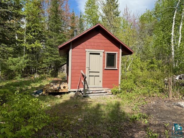 13321 Lodge Rd, Ely, MN 55731 - view of shed with a wooded view