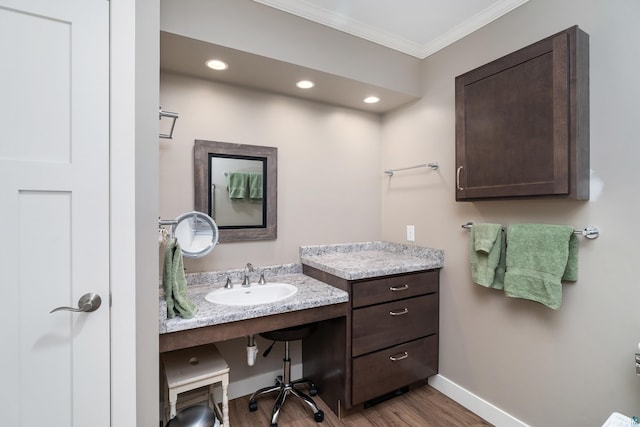 244 E 3rd St, Knife River, MN 55609 - bathroom featuring ornamental molding, wood finished floors, baseboards, recessed lighting, and vanity