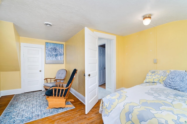 244 E 3rd St, Knife River, MN 55609 - bedroom featuring wood finished floors and baseboards