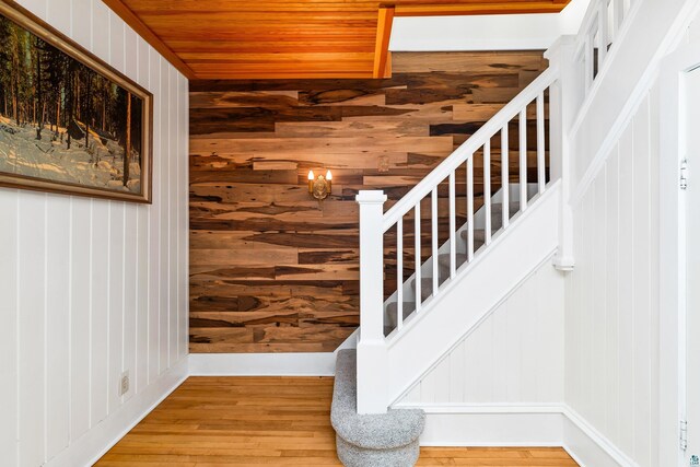 244 E 3rd St, Knife River, MN 55609 - stairs featuring wood finished floors and wooden walls