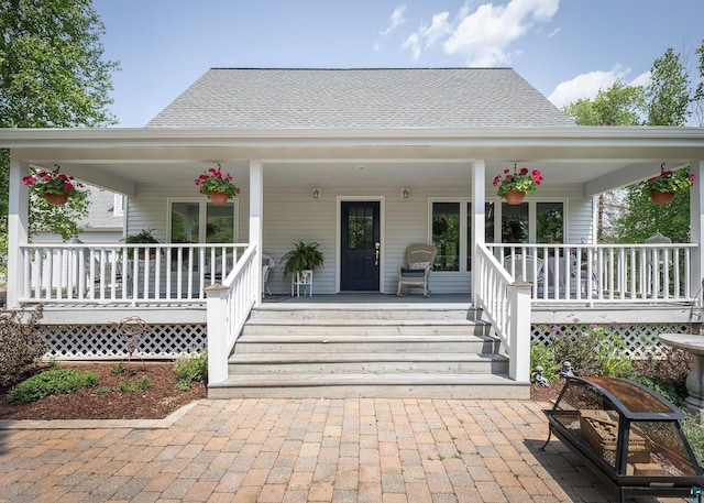 6220 N Tischer Rd, Duluth, MN 55804 - property entrance with a porch and a shingled roof