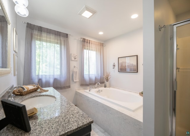 6220 N Tischer Rd, Duluth, MN 55804 - full bath featuring a garden tub, vanity, a shower stall, and recessed lighting