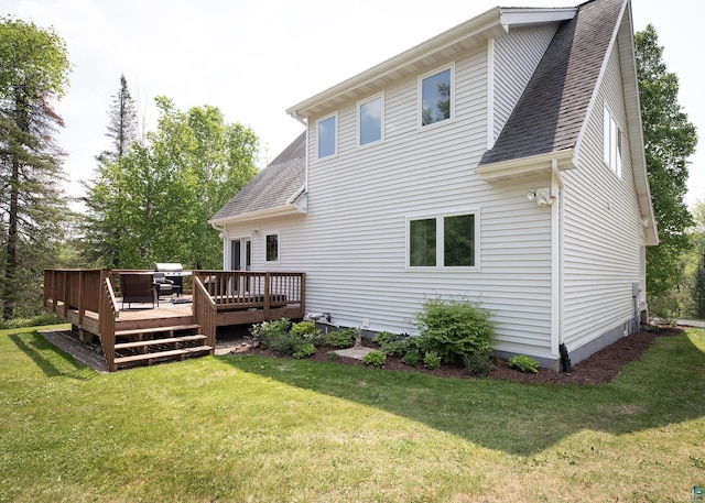 6220 N Tischer Rd, Duluth, MN 55804 - back of house with roof with shingles, a deck, and a yard