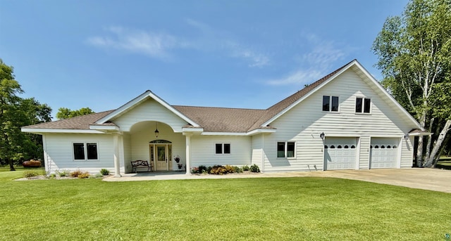 20 Mulberry Ln, Babbitt, MN 55731 - view of front of property featuring concrete driveway, a front lawn, a garage, and a shingled roof