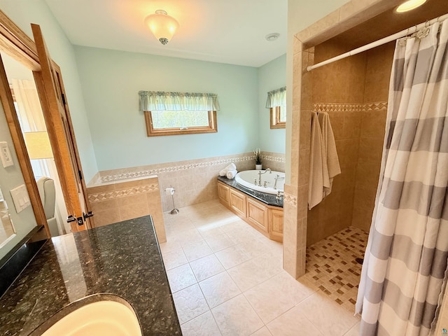 20 Mulberry Ln, Babbitt, MN 55731 - full bath with a bath, tile patterned floors, a tile shower, a wainscoted wall, and tile walls