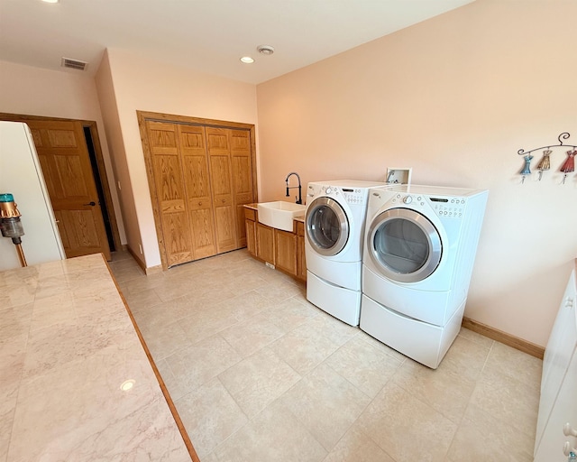 20 Mulberry Ln, Babbitt, MN 55731 - washroom featuring washing machine and dryer, cabinet space, and baseboards