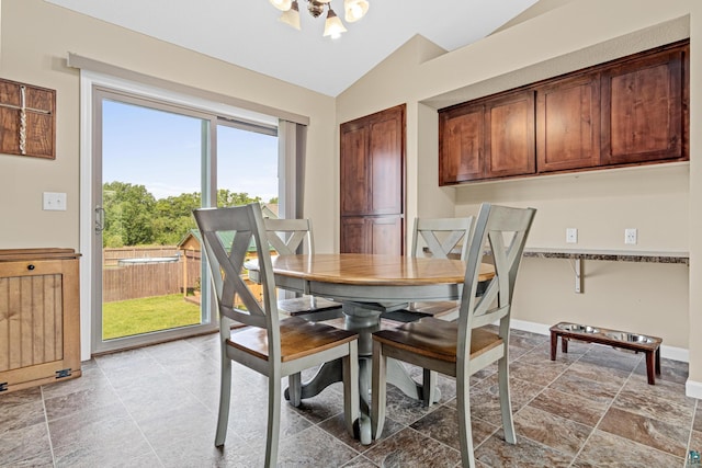 38006 Harvester Ave, North Branch, MN 55056 - dining room with vaulted ceiling, a chandelier, and baseboards