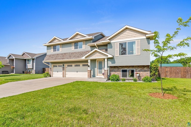 38006 Harvester Ave, North Branch, MN 55056 - view of front of property with an attached garage, concrete driveway, and stone siding