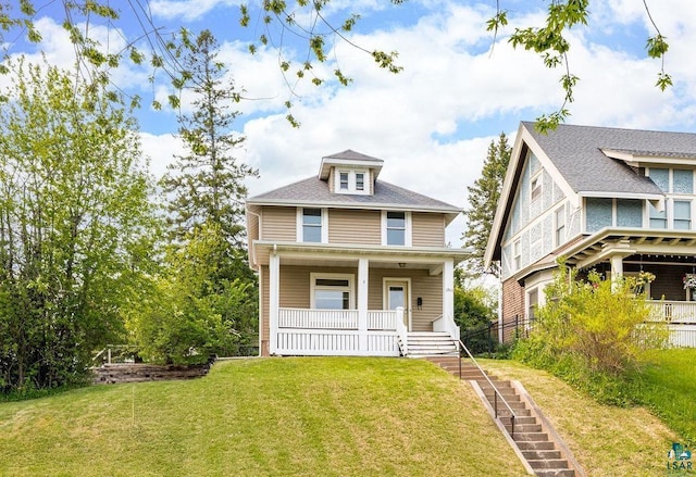 1901 E 5th St, Duluth, MN 55812 - american foursquare style home featuring covered porch and a front lawn