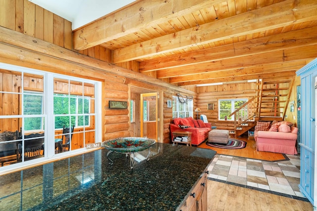204 E Deeryard Rd, Grand Marais, MN 55604 - kitchen with wood-type flooring, open floor plan, rustic walls, dark stone counters, and wooden ceiling with exposed beams