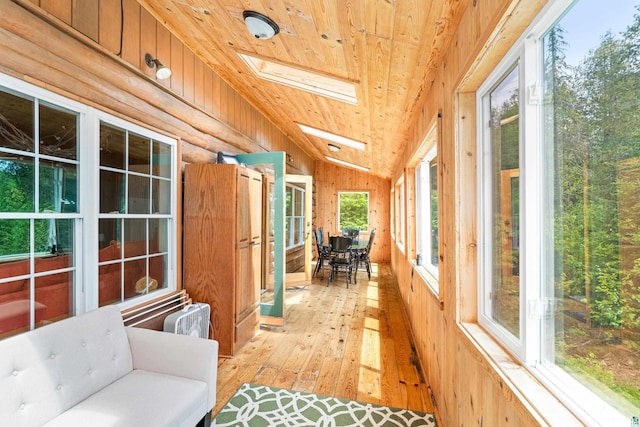 204 E Deeryard Rd, Grand Marais, MN 55604 - sunroom with wood ceiling, wood-type flooring, a skylight, wooden walls, and vaulted ceiling
