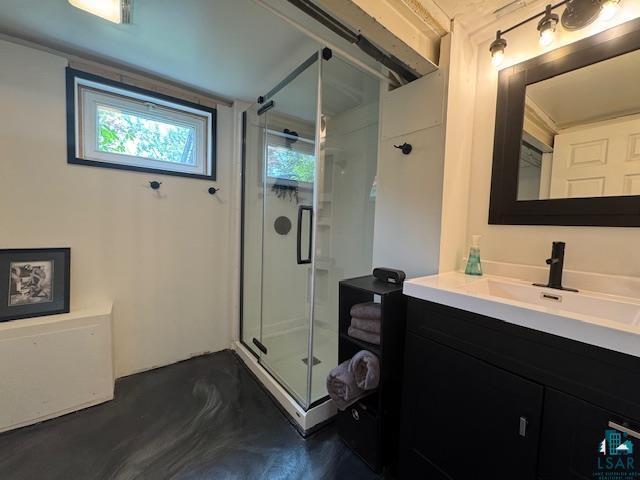 17 S 57th Ave E, Duluth, MN 55804 - bathroom with a shower stall, vanity, and concrete floors