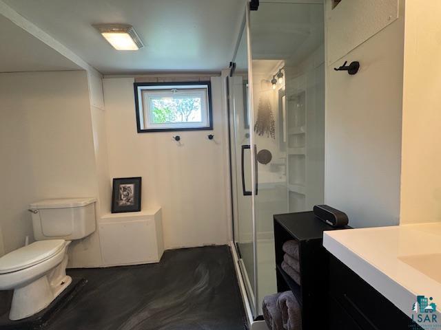 17 S 57th Ave E, Duluth, MN 55804 - full bathroom featuring toilet, vanity, and a stall shower