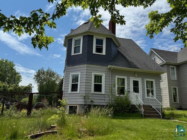 17 S 57th Ave E, Duluth, MN 55804 - back of property with a chimney and roof with shingles