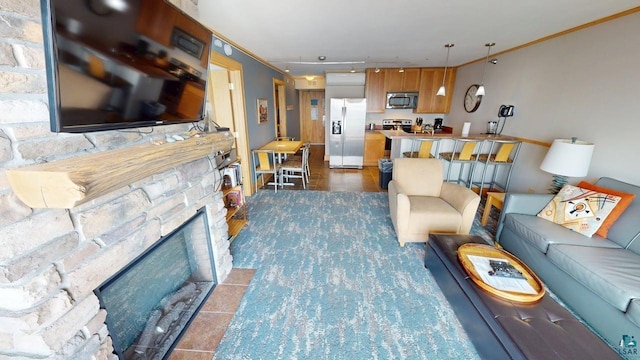 21 E Wisconsin St Unit 302, Grand Marais, MN 55604 - living room featuring a fireplace and ornamental molding