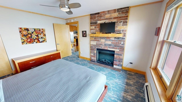 21 E Wisconsin St Unit 302, Grand Marais, MN 55604 - carpeted bedroom with a stone fireplace, baseboard heating, baseboards, crown molding, and a ceiling fan