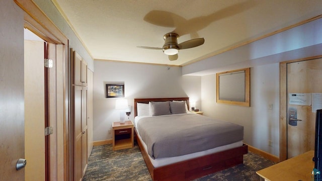 21 E Wisconsin St Unit 302, Grand Marais, MN 55604 - bedroom with baseboards, a ceiling fan, and dark carpet