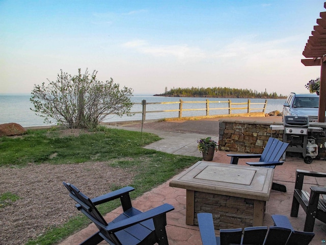 21 E Wisconsin St Unit 302, Grand Marais, MN 55604 - view of patio / terrace with a water view and a grill